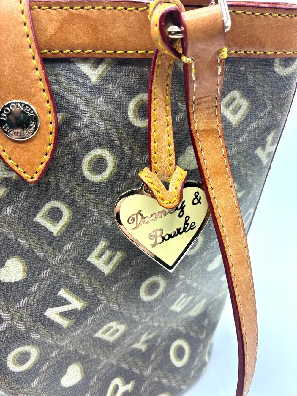 Y2K Dooney & Bourke Crossword Monogram Bucket Shoulder Bag Heart Charm - Picture 2 of 16